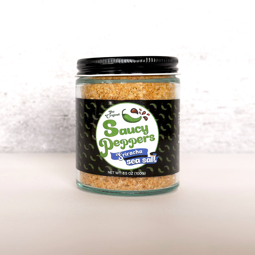 Sriracha Infused Sea Salt by Saucy Peppers artisanal condiment company with habanero chili pepper and sriracha flavors.