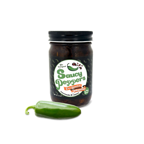 Jar of Original Saucy Peppers marinade and sauce with fresh jalapeno on white background